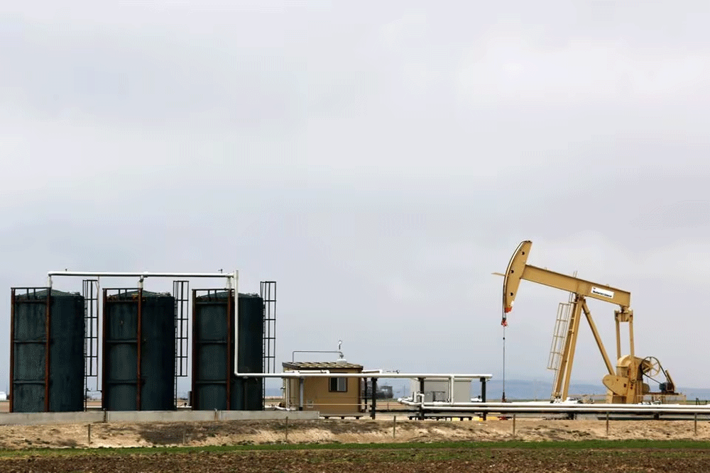Oil rises on weaker dollar, IEA demand upgrade