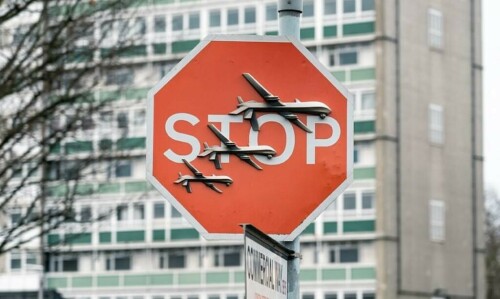 Banksy artwork showing drones on a STOP sign stolen in London