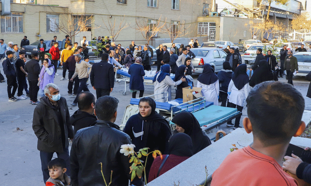 Iran arrests suspects over bomb blasts, mourners demand revenge