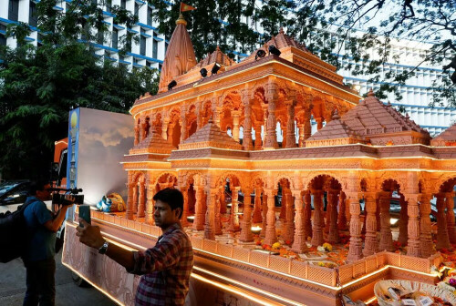 Indian devotees splurge on jets, gold idols as controversial Hindu temple opens
