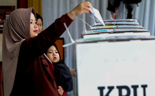 Indonesians vote to replace Jokowi, floods disrupt some polling