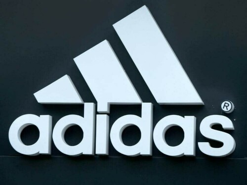 Adidas posts first loss in 30 years but sticks to dividend