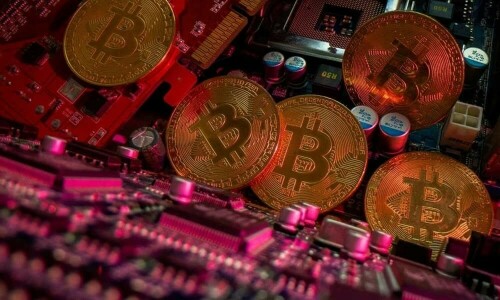 Volatile bitcoin falls from record high as crypto frenzy hits pause