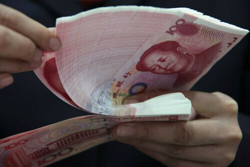 China&rsquo;s yuan dips against dollar, downward pressure persists