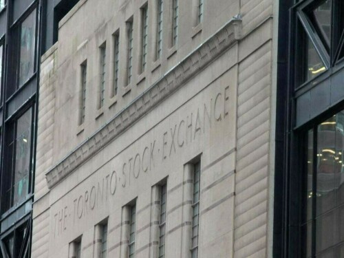 TSX pulls back from record highs to trade flat