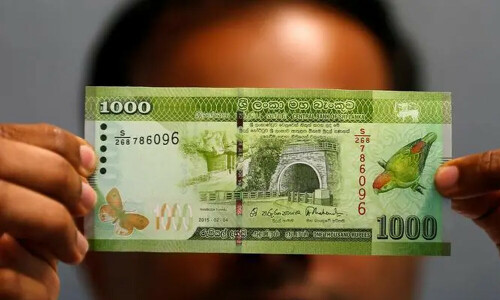 Sri Lanka aims to halve debt servicing costs, central bank chief says