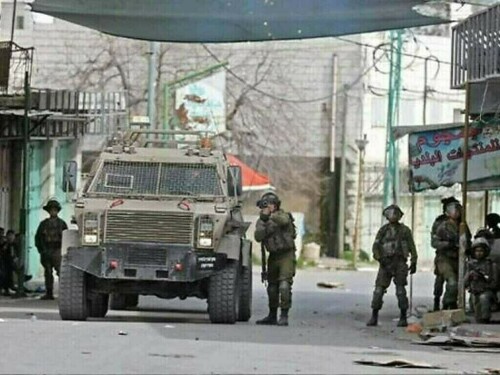 Israeli forces tie wounded Palestinian to jeep in West Bank raid