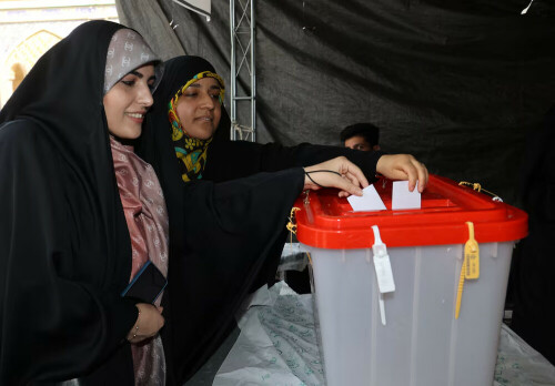 Iranians vote in run-off presidential election amid widespread apathy