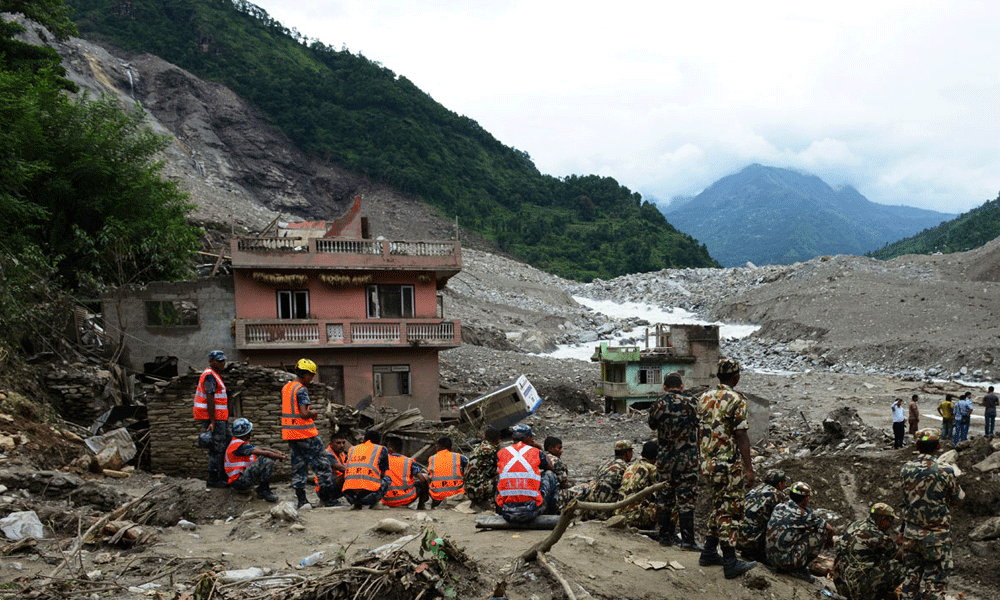 Nepal landslides sweep two buses into a river, 65 passengers missing
