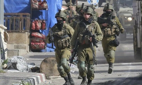 Palestinians say Israel troops kill two in West Bank raids