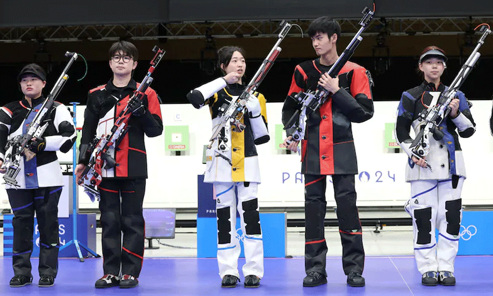 China takes first Olympic gold as rain disrupts Games