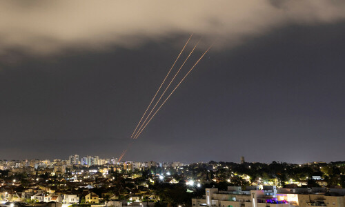 Iran launches salvo of ballistic missiles at Israel, warns against response