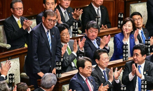 Lawmakers vote to keep embattled Ishiba as Japan PM