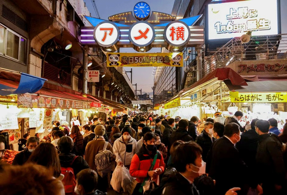 Japan says its economy likely to mark first positive output gap in 7 years