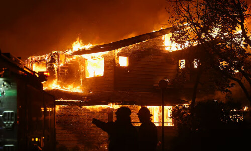 Wildfire rages in Los Angeles, forcing 30,000 to evacuate