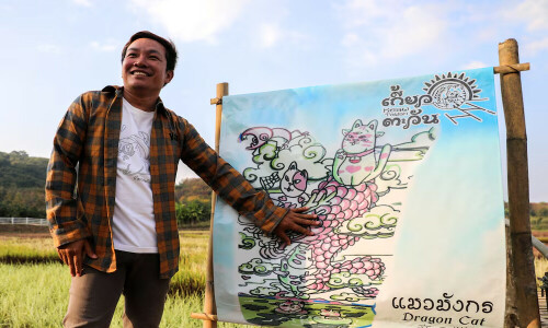 Thai rice fields transformed into vibrant art depicting red dragon, feline deity