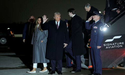 Donald Trump arrives in Washington as inauguration celebrations begin with Elvis impersonator, fireworks