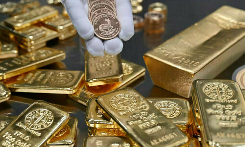 Gold jumps to near all time-high, set for weekly gain