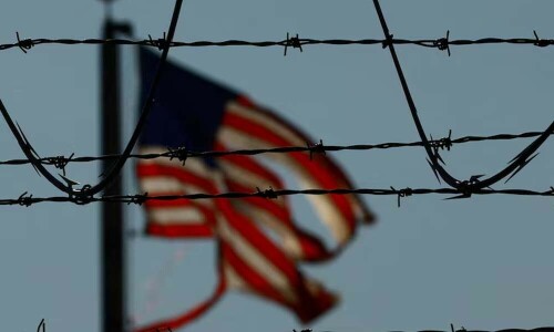 US military aircraft deport migrants, as Pentagon readies more troops for border