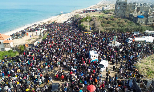 Gaza officials say tens of thousands blocked from reaching north at Israeli barrier