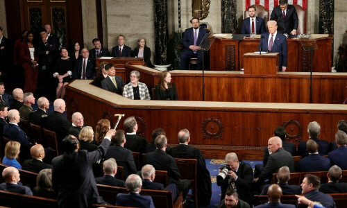 Trump takes victory lap in speech to Congress, Democrats protest
