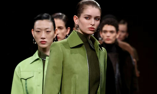 Hermes shows slick leather ensembles on dirt runway at Paris Fashion Week