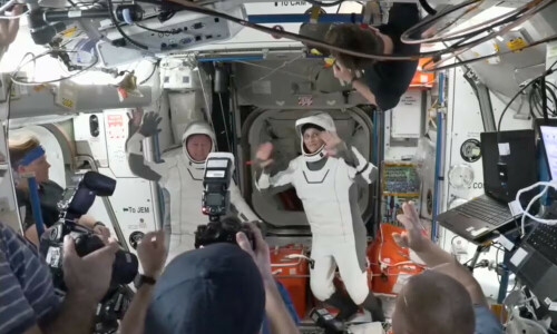 NASA astronauts head home on SpaceX capsule after drawn-out space station stay