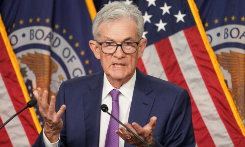 Fed leaves rates unchanged, cites rising risk of higher inflation and unemployment