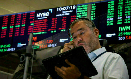 Wall Street rises on jobs data optimism; Tesla rebounds