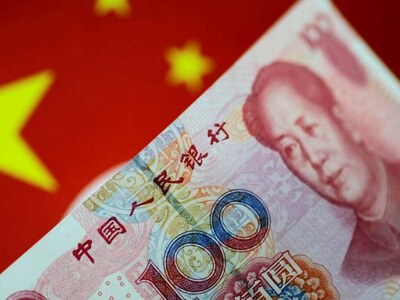 China’s yuan slips against dollar