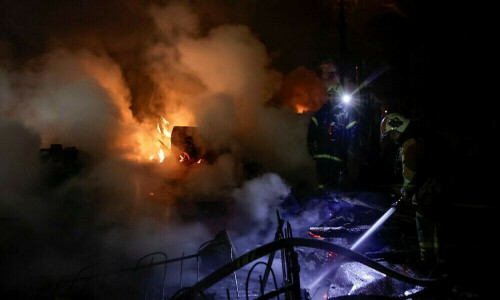 Russian drones bear down on Ukrainian capital, up to three injured