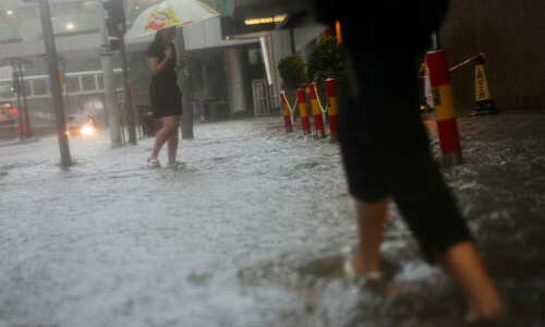 Hong Kong issues highest weather warning, as rains shut schools, courts and hospital wards