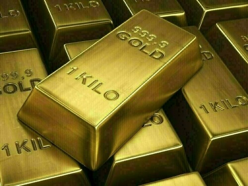 Gold inches lower as dollar gains, markets await Fed appointments