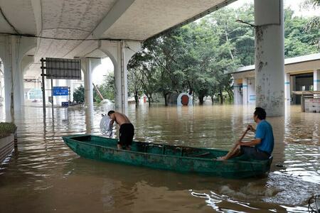 Tens of thousands evacuated as torrential rains drench south China