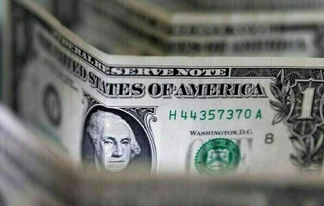 Dollar gains, but on track for weekly loss