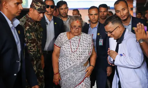 Nepal returns to calm as first woman PM takes charge, visits wounded