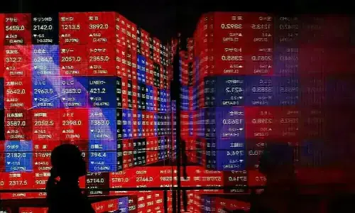 Stocks churn as traders assess Fed outlook following rate cut