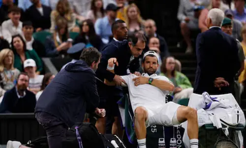 Dimitrov marks return from pectoral injury with win in Paris