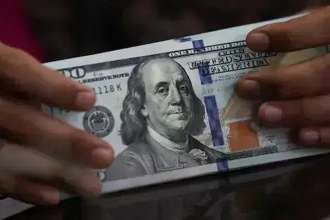 Dollar gains as Fed cut bets recede; yen on guard