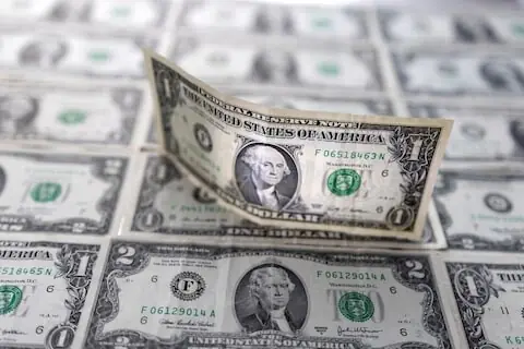 Dollar flirts with three-month peak as investors look to US data releases