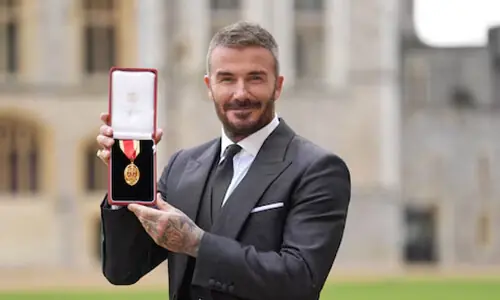 David Beckham knighted for services to sport and charity