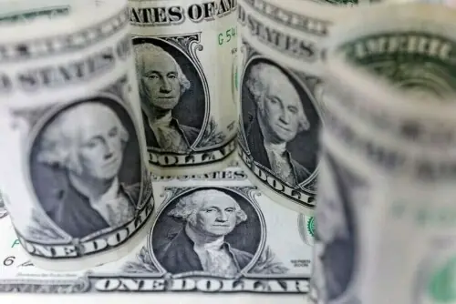 Dollar slumps on worries of what clearing US data fog might show
