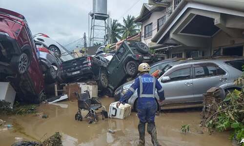 Typhoon flooding kills 26, strands thousands in central Philippines