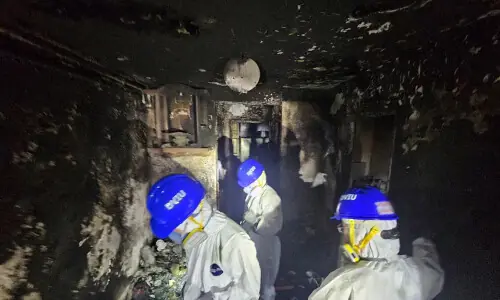 Police comb fire-ravaged Hong Kong apartments, death toll at 146