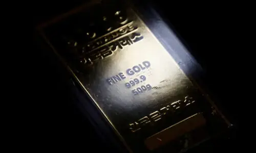 Gold flat as Treasury yields counter soft dollar ahead of key US data