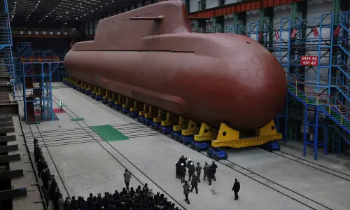 North Korea&rsquo;s Kim Jong Un views submarine construction, oversees missile launch