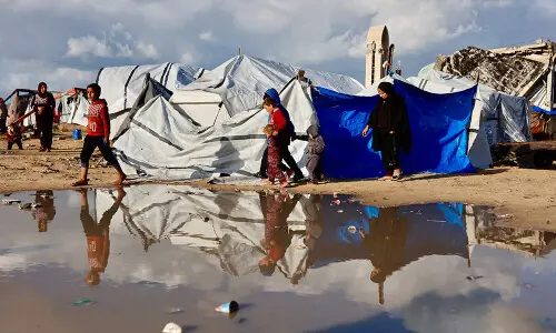 &lsquo;Shivering from cold and fear&rsquo;: winter rains batter displaced Gazans