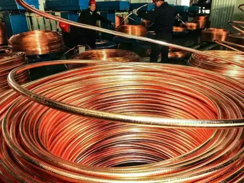 Copper and aluminium climb as weak dollar extends metals rally