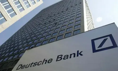 Deutsche Bank exceeds profit expectations a day after police search