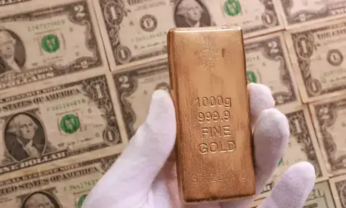 Gold gains on softer dollar; Iran-US talks in focus